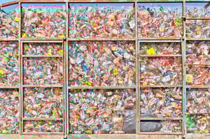 plastic bottles behind a mesh